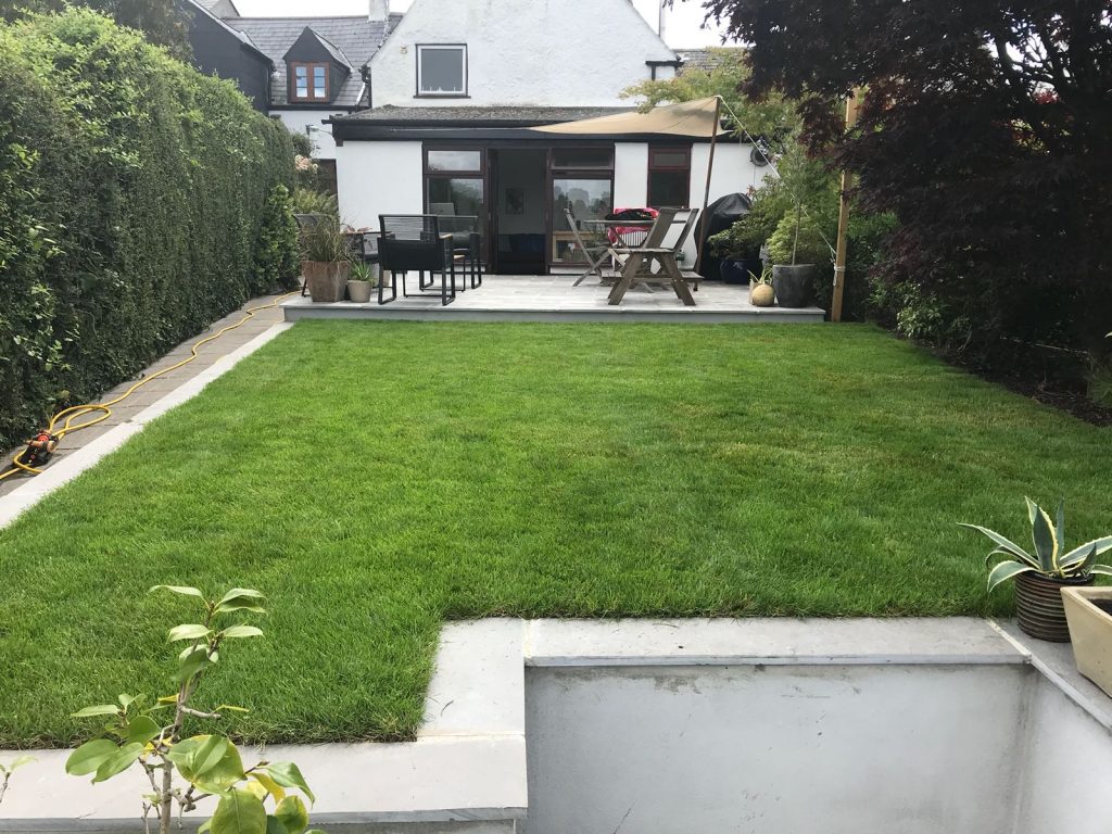 Landscape management services include making this level lawn and laying new turf